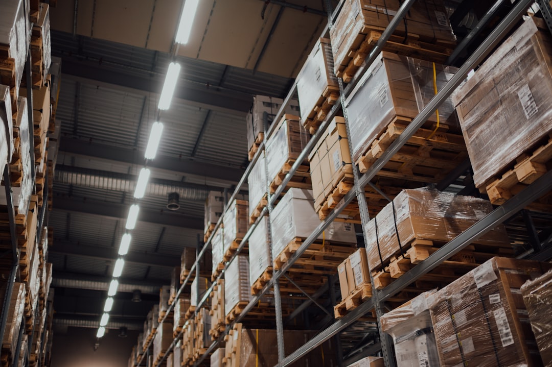 brown-cardboard-boxes-on-white-metal-rack-bnba1h-ngdy
