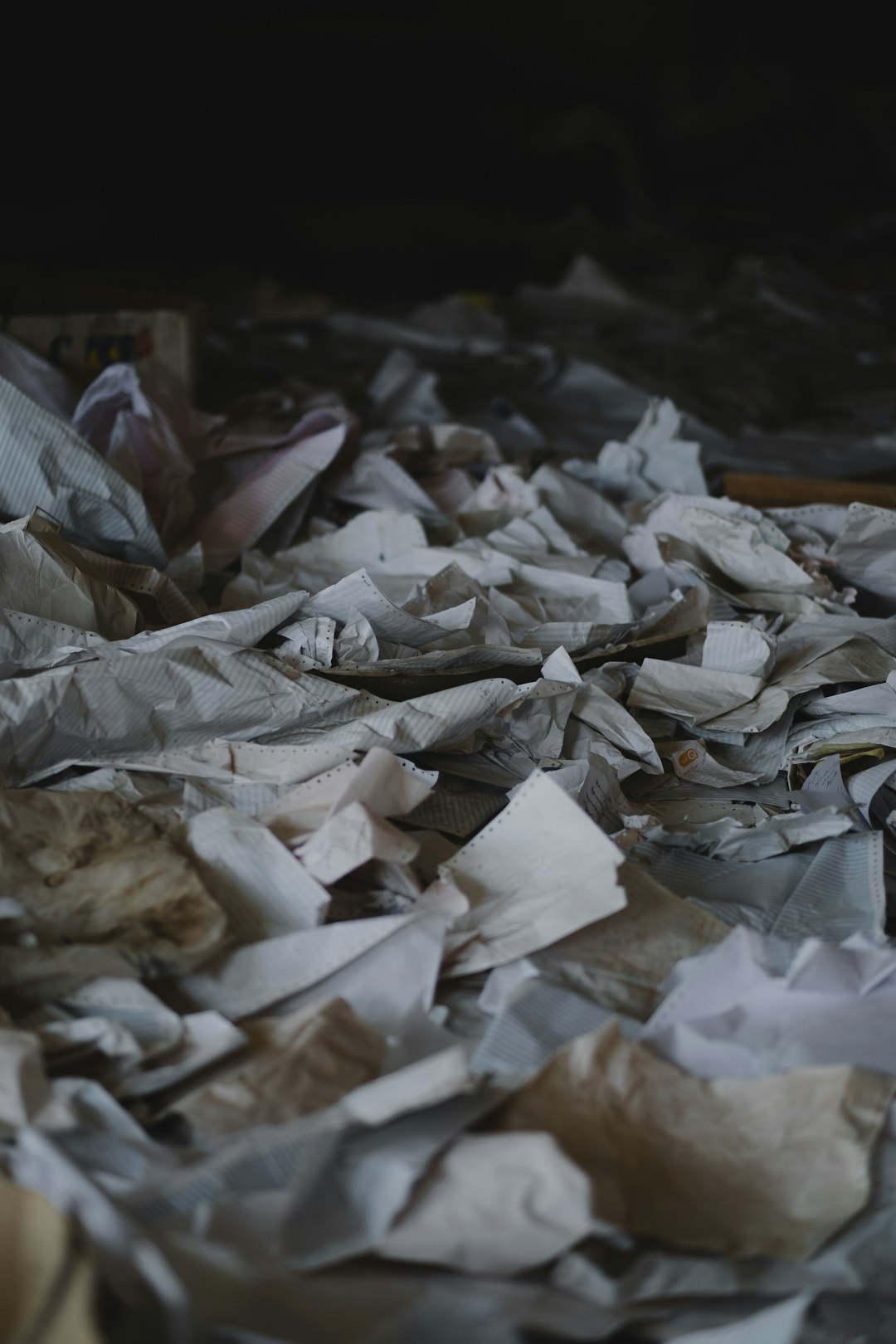 Ruined papers strewn across the destroyed office of Rashid Bank in Shingal, following war with the Islamic State.
